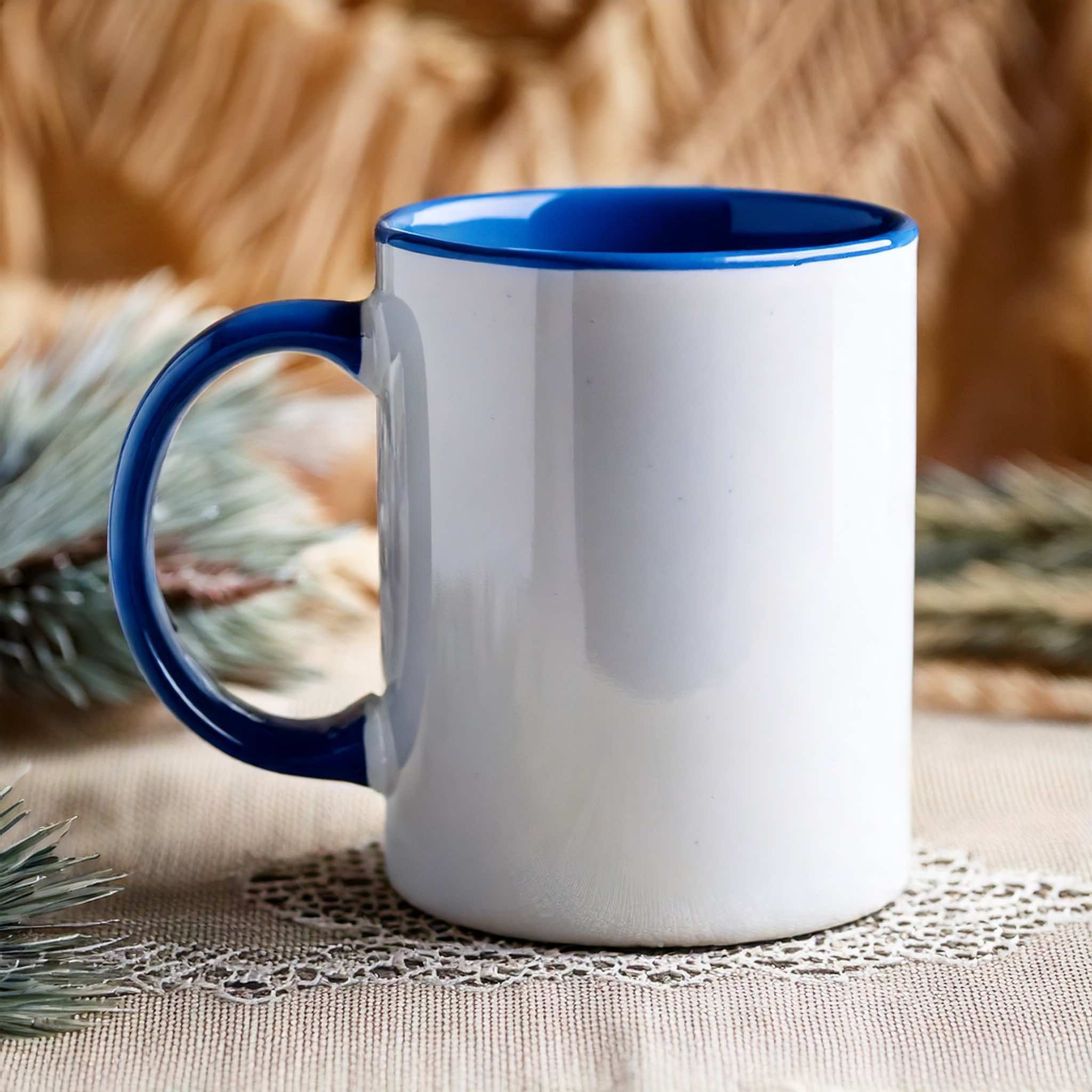 Ceramic mug with blue handle and interior