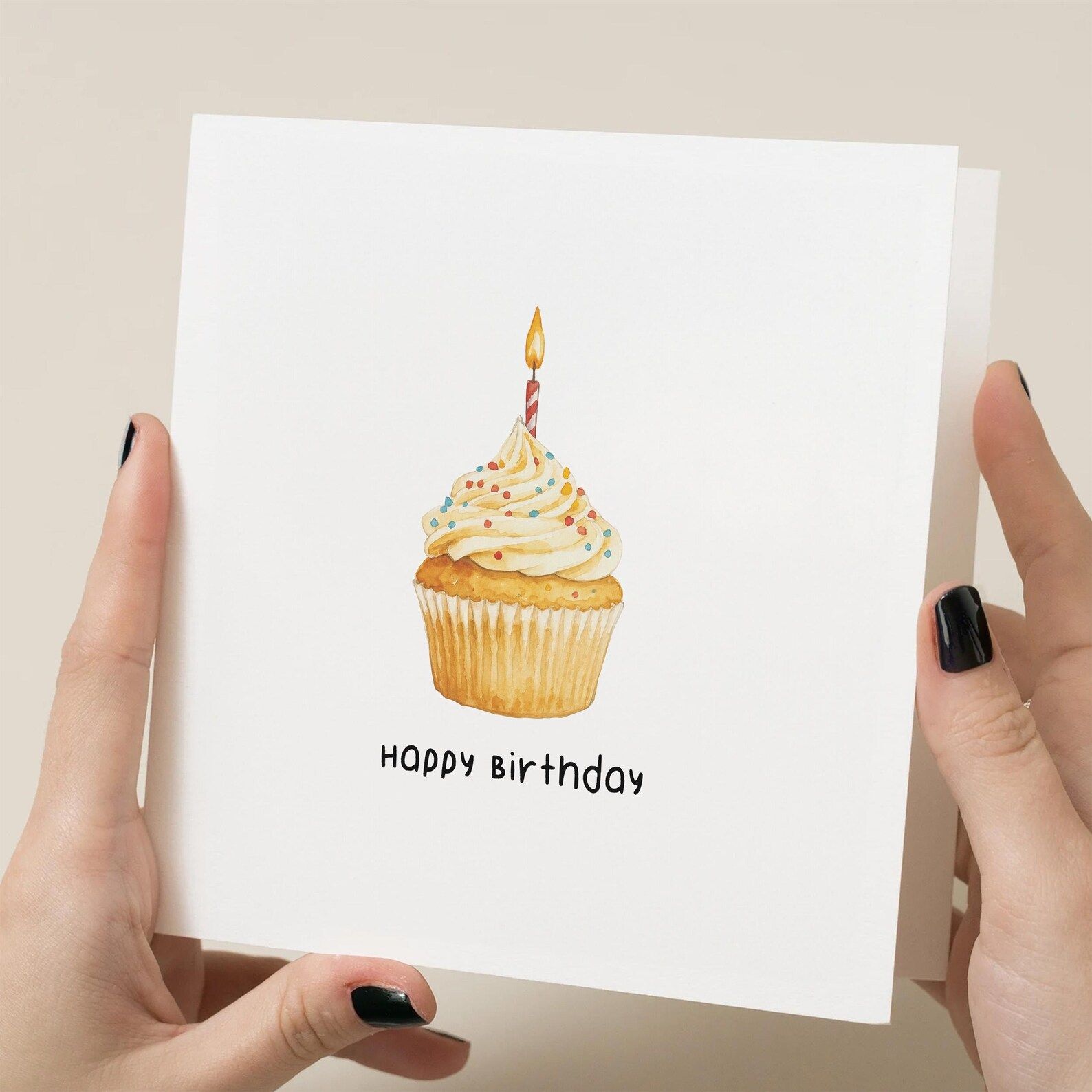 Personalised Happy Birthday greeting card with cupcake illustration held in hands