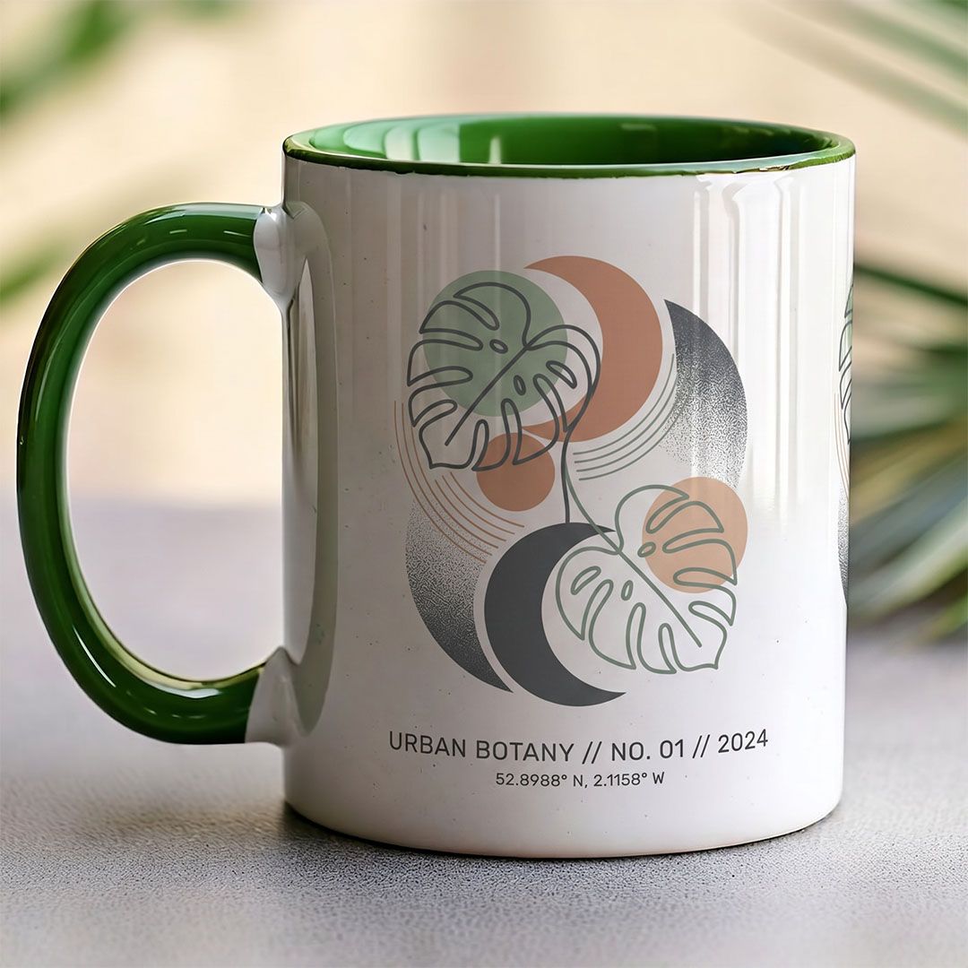 Personalised ceramic mug with botanical design and green inner handle