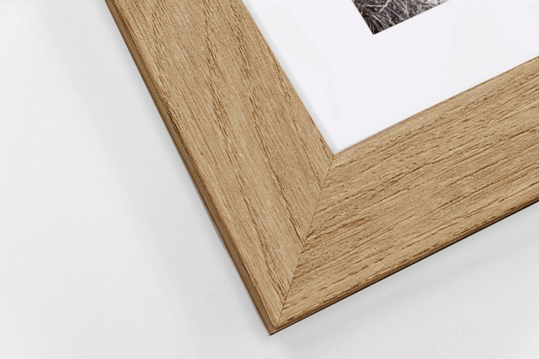 Close-up of oak frame with white mount