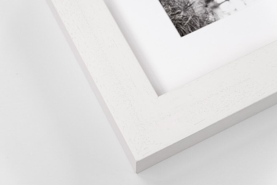 Close-up of white frame with white mount